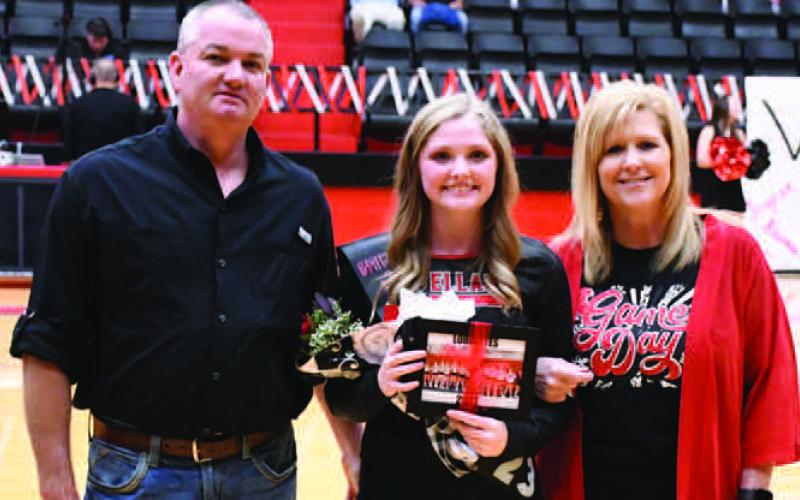 LOBOETTE SENIOR NIGHT- The Levelland Loboette volleyball program honored their seniors in their final home game Tuesday, October 25th. Loboette Brittan Dobson was escorted by her parents Scott and Amee Dobson. (Staff Photo by Dom Puente)