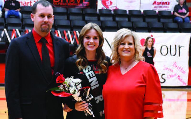 LOBOETTE SENIOR NIGHT- The Levelland Loboette volleyball program honored their seniors in their final home game Tuesday, October 25th. Loboette Alanna Worley was escorted by her parents Alan and Charlotte Worley. (Staff Photo by Dom Puente)