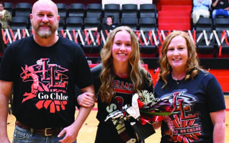 LOBOETTE SENIOR NIGHT- The Levelland Loboette volleyball program honored their seniors in their final home game Tuesday, October 25th. Loboette Chloe Carpenter was escorted by her parents Ray and Shannon Carpenter. (Staff Photo by Dom Puente)