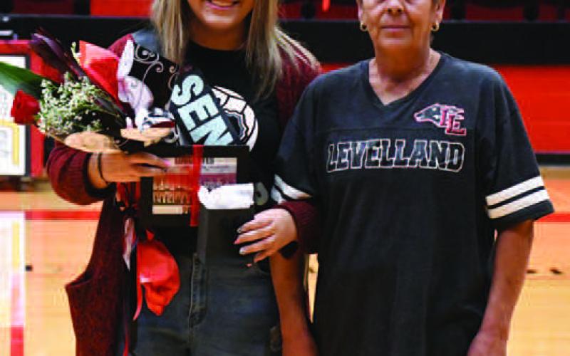 LOBOETTE SENIOR NIGHT- The Levelland Loboette volleyball program honored their seniors in their final home game Tuesday, October 25th. Loboette manager Sierra Arrendondo was escorted by her grandmother Maria Mendez. (Staff Photo by Dom Puente)