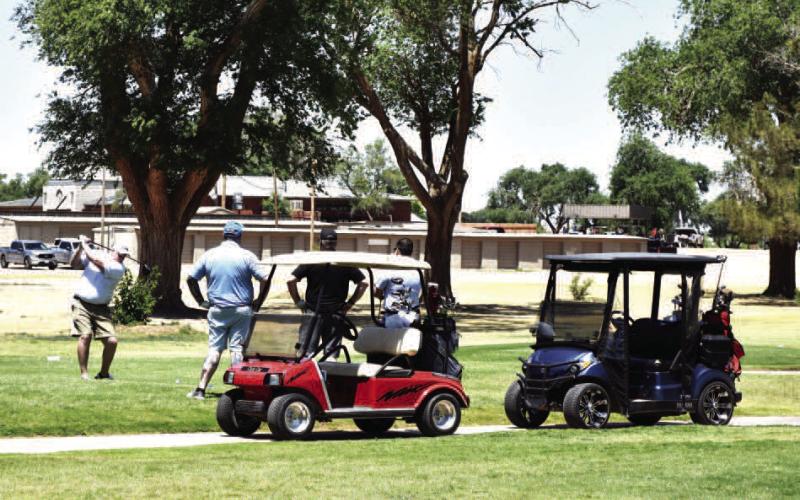 ENJOYING THE WEATHER-- Golfers enjoyed the warm weather during the Levelland Chamber of Commerce annual golf tournament held this past Monday. The tournament was held at the Levelland County Club. (Staff photo) (See “Chamber Golf Tournament Results” continued on page 10)