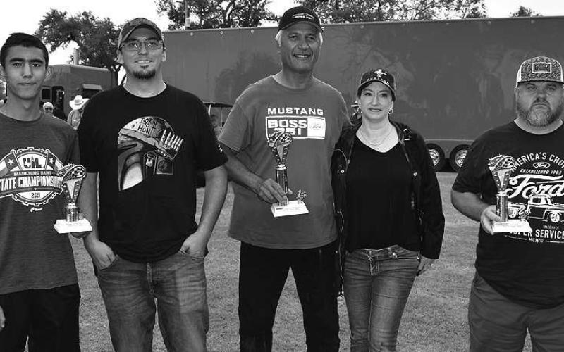 FORDMUSCLECARS– Ford muscle cars made their appearance at the annual Thunder on the Plains Car Show Saturday in City Park. Pictured are the winners of the Ford Muscle Cars from 1964 to1981 category: first place winners Abel and Lisa Rios, 1971 Ford Boss 351; second place, James Henley, 1964 Ford F100; and third place, Joshua Shelton, 1972 Ford Mustang. (Staff Photo)