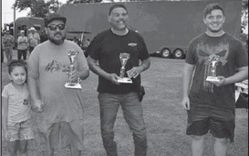 NEWERCUSTOMTRUCKS– Custom Trucks from 1991 to present were recognized at the annual Thunder on the Plains Car Show Saturday in City Park. Pictured are the winners of the Custom Truck 1991 to present category: first place winner Jose Marrufu, 2009 Ford F350; second place, Jesse Garza, 1996 Chevy Z71; and third place, Dalton Lewis 1996 Ford Bronco. (Staff Photo)