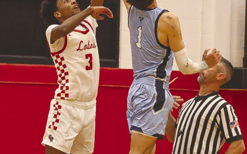 TIP-OFF - Levelland Lobo Eryk Jones jumped for the tip-off against the Rangers this past Tuesday where the Lobos won at home. Jones finished with a team high of 10 points in the game. (Staff photo by Aalijah Soliz)