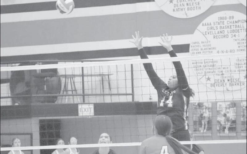 NOT OVER HERE - Levelland Loboette Trinity Wafers went up over the net to block the shot for the Loboette defense who swept the Brownfield Lady Cubs last Tuesday at the Levelland High School Gymnasium. (Staff photo by Aalijah Soliz)