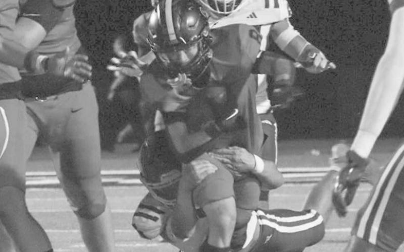 GOOD BALANCE - Levelland Lobo Ricky Rodriguez ran through an arm tackle this past Friday during the team’s game against the Lake View Chiefs at home. (Staff photo by Aalijah Soliz)
