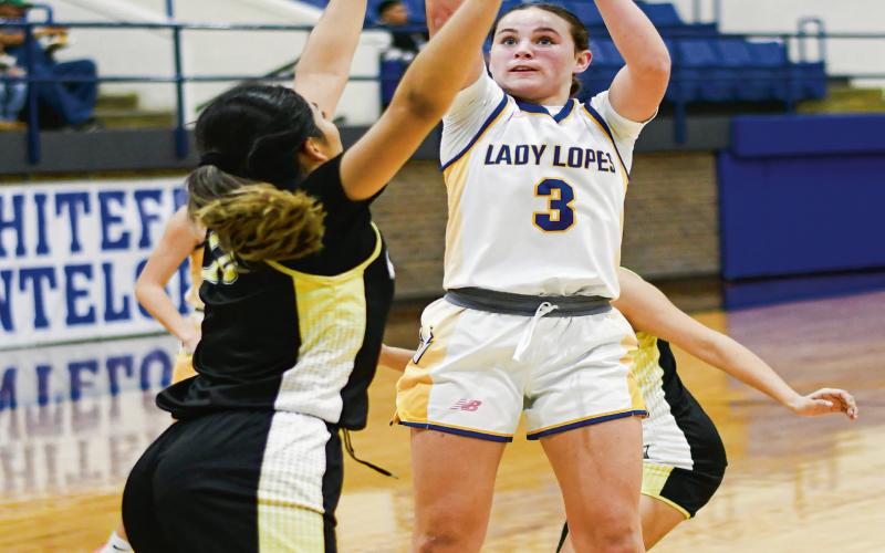 MIDDY MAGICIAN - Whiteface Lady Lope Kambry Sanders pulls up for a mid-range jump shot during their home game against Morton this past Tuesday night. Sanders led the Lady Lopes with 25 points. (Staff photo by Jentezen Smith)