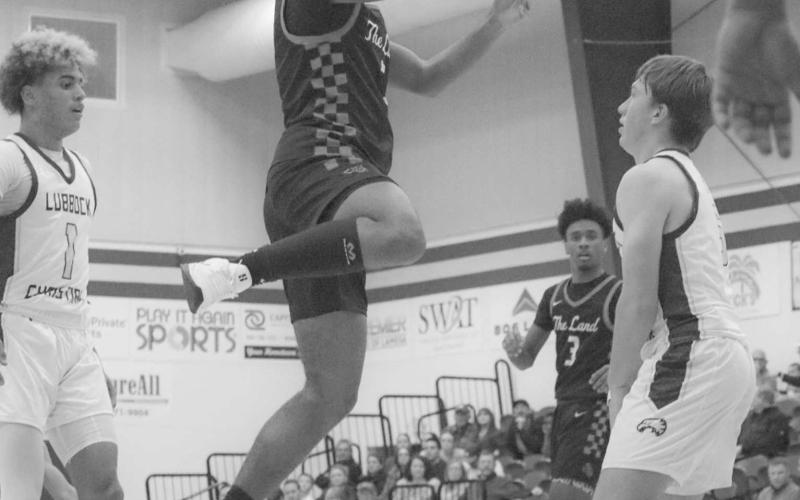 TOO SMALL - Levelland Lobo Sean Landrum shot the ball mid-air to avoid the charging call against Lubbock Christian on the road. (Staff photo by Aalijah Soliz)