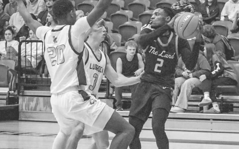 STAY CALM - Levelland Lobo Elijah Jordan looked to pass the ball on the baseline during the team’s game against the Eagles on the road. (Staff photo by Aalijah Soliz)