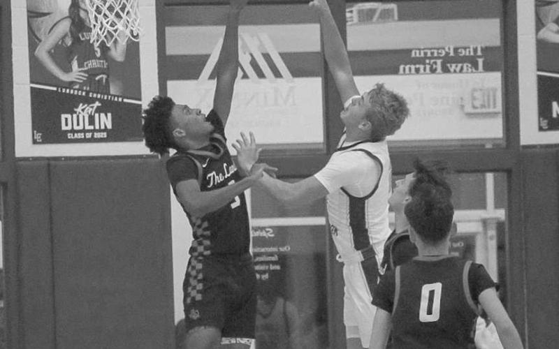 MEET YOUAT THE TOP- Levelland Lobo Eryk Jones got vertical to block the shot against the Eagles on the road in Lubbock. (Staff photo by Aalijah Soliz)