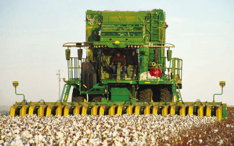 HARVESTSEASON – Producers are continuing to harvest their cotton crop throughout west Texas. Pictured is Efren Nunez operating a John Deer CS 770 with the help of his farm-hand Jesus Trillo. Nunez has been working under Justin Stracener who recently acquired the CS 770 for this year’s crop. Spending a couple of days in one area, Nunez and Trillo covered roughly 275 acres. (Staff Photo by Dom Puente)