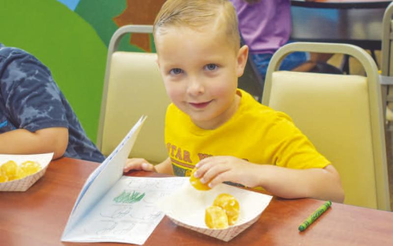DOODLES AND DONUTS- The Hockley County Library Summer Program held this weeks event called Doodles and Dounuts. The participants were given a drawing book named Doodles and Donuts so each participant could take home. Pictured is Driscoll O’Hearon, one of the participants in the program. The Summer Reading Program’s last day will be Wednesday, July 31. (Photo courtesy of Emily Campos)