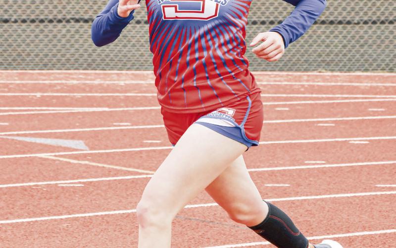 DISTANCE RUNNING MACHINE - Sundown’s Kaytlin Clausen races in the 3,200-meter run during the Son Qualls Relays this past Friday at Sudan High School. (Staff photo by Jentezen Smith)