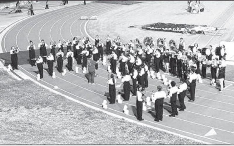 The Levelland Lobo Band warms up before competing at the UIL Region 16 Marching Band competition at Lowrey Field in Lubbock on Saturday. The band earned a Superior rating and will advance to the Area competition on Oct. 25.