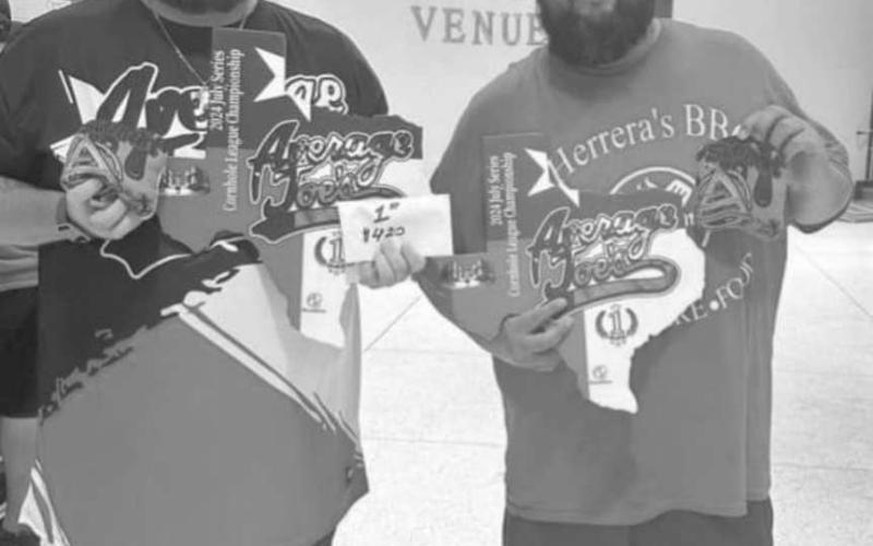 WINNERS - Gabriel Herrera and David Riddle won the Average Joe’s Cornhole Tournament this past month. (Photo courtesy of AJ Vigil)