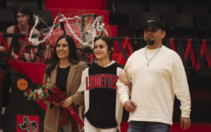 SENIOR - Levelland Loboette Carly Tienda was escorted out by her parents Erik and Amanda Tienda during their senior night last Tuesday night. Her future plans include going to South Plains College to get her associates degree then transfer to Lubbock Christain University and attend nursing. Her advice for future players are “To become friends with one another because they’re the ones that make the game fun.” (Staff photo by Aalijah Soliz)