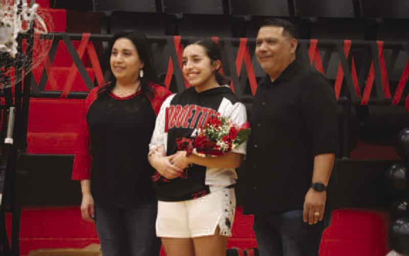 SENIOR - Levelland Loboette Olivia Velardez was escorted out by her parents Jacob and Linda Velardez this past Tuesday night for senior night. Olivia’s future plans are to go to college and study in graphic arts. Her advice for future players are “Make sure to always set their alarm for morning practice.” (Staff photo by Aalijah Soliz)