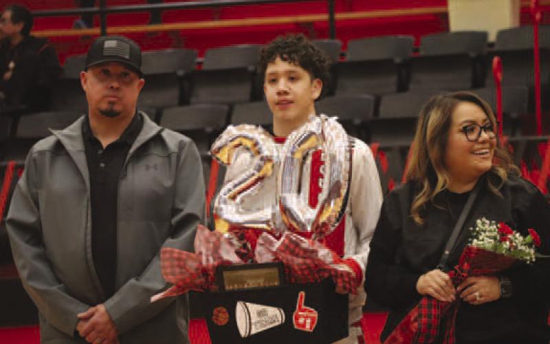 SENIOR - Levelland Lobo Landon McCoy was walked out by his parents Monica and Bobby McCoy before the teams game on senior night. Landon’s future plans are to continue education and business and South Plains College in Levelland. McCoy’s favorite quote is “I can do all things through christ.” Philippians 4:13 (Staff photo by Aalijah Soliz)