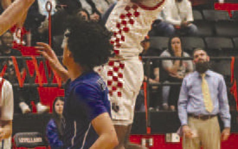 ATHLETIC - Lobo Jayden Castillo made the acrobatic lay-up during the teams win last Tuesday night. (Staff photo by Aalijah Soliz)
