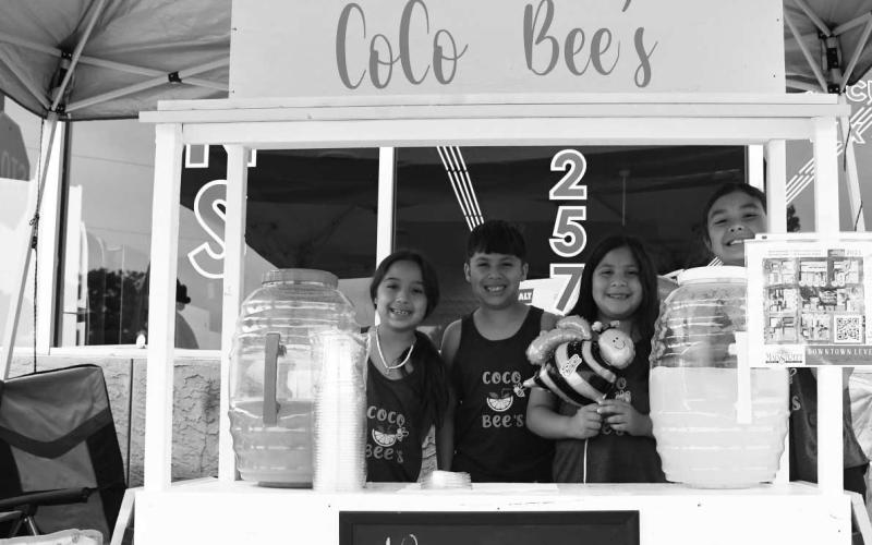 LEMONADE DAY! - CoCo Bee’s lemonade stand at the First Saturday Shop the Square and Lemonade Day on the downtown Levelland square June 3. My Main Squeeze lemonade stand won Best Tasting Lemonade andL&amp;amp;L’s lemonade stand won Best Decorated. (Staff Photo Victoria Byrnes)