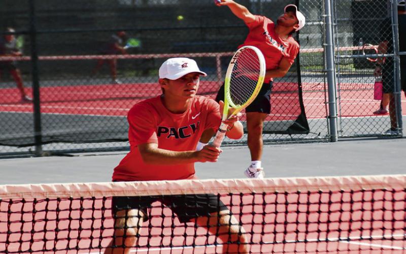 DOUBLE THE INTENSITY – Nathan Ellis gets in position for the set while William Canon serves it in a double’s matchup against Big Spring at the Levelland Tennis Courts on August 2. (Staff photo by Jentezen Smith)