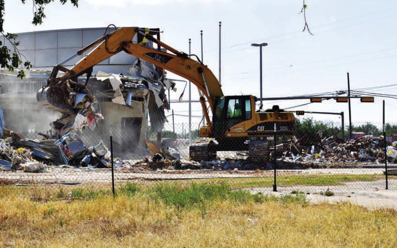 DEMOLITION - Demolition began on the former Platinum Bank building located at the corner of Highway 114 and N College Avenue. Demolition began Monday with half of the building torn down by mid-week. Demolition of the entire building was completed by Thursday afternoon. (Staff Photo by Victoria Byrnes)