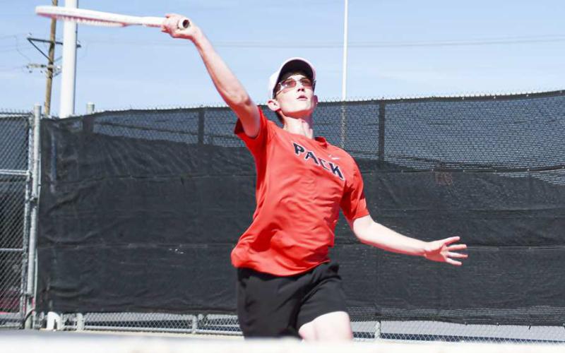 POWER SERVE – Nathan Ellis delivers a powerful serve during a tennis match against Lubbock-Cooper Liberty this past Tuesday at the Levelland tennis courts. (Staff Photo by Jentezen Smith)