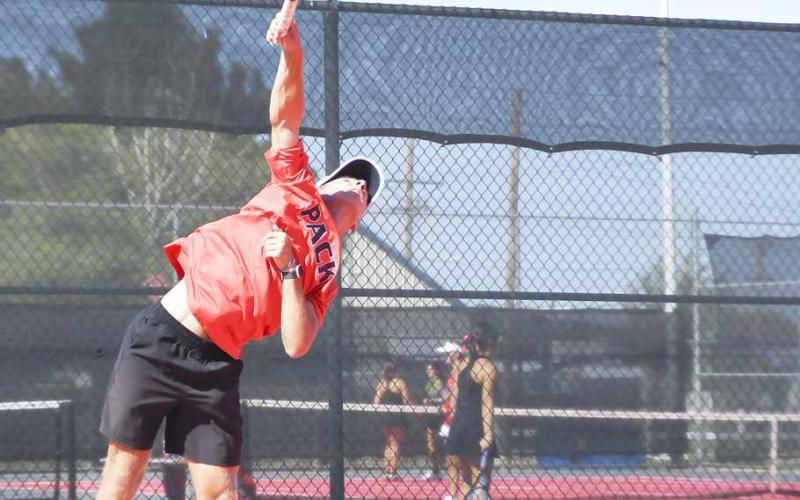 POWER SERVE – Nathan Ellis delivers a powerful serve during a tennis match against Lubbock-Cooper Liberty this past Tuesday at the Levelland tennis courts. (Staff Photo by Jentezen Smith)