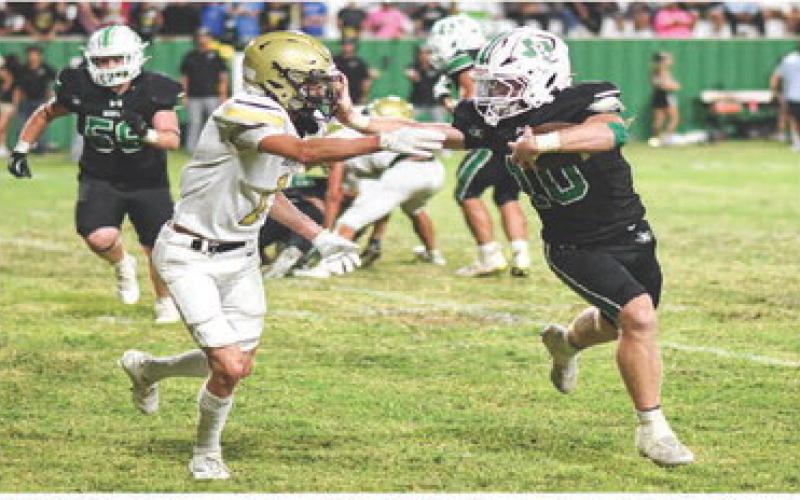 STIFF ARM - Senior running back Ryland Keith stiff arms a Sudan defender while rushing the football during Ropes’ homecoming football game this past Friday night at Ropes Eagle Stadium. The Eagles would win 55-13, (Staff photo by Jentezen Smith)
