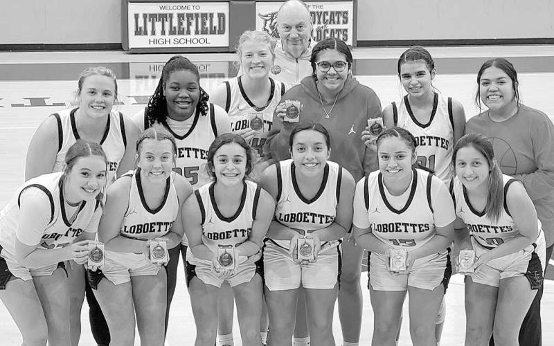 LITTLEFIELD CHAMPS- The Levelland Loboettes wrapped up their tournament portion of their schedule with a first-place finish in the Littlefield Basketball Tournament. The Loboettes were off Tuesday, but will return to the court January 6th for their district opener in Big Spring. (Photo Courtesy of Derek Lopez)