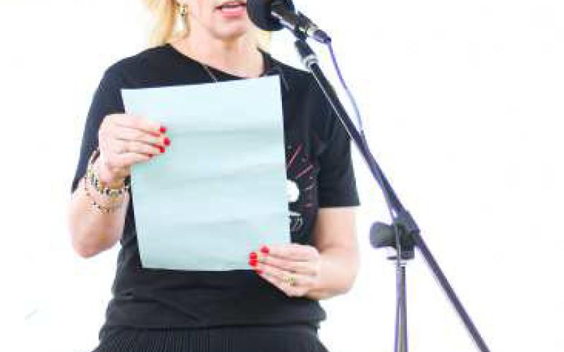 Mayor Breann Buxkemper read the Mayoral Proclamation at the Centennial celebration for the city of Levelland held on Sunday. The decision was made to move the event due to weather concerns. (Staff photo by Jentezen Smith)