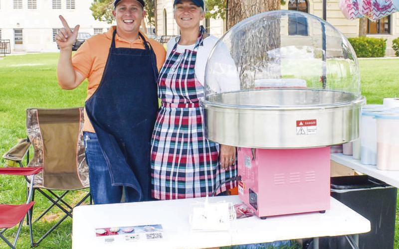 TWISTED SUGER- Gina and Joshua Randol participated in the Food Truck Thursday event in downtown Levelland Thursday at the Hockley County Courthouse lawn. Gina and Joshua are both teachers for the LISD and started a buiness selling cotton candy for parties and events. Pictured is Joshua and Gina Randol (Photo courtesy of Emily Campos)