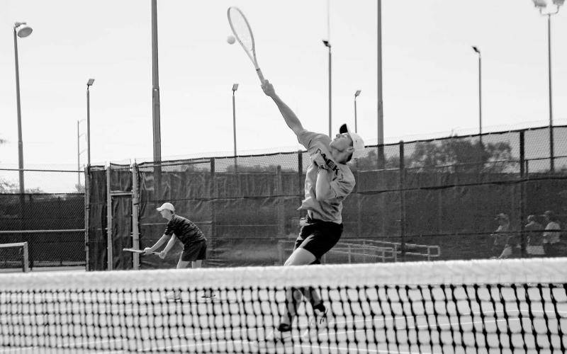 OVERHEAD SMASH – Nathan Ellis performs an overhead smash during a tennis match against All Saints on August 12 at the Burgess-Rushing Tennis Center in Lubbock. (Staff photo by Jentezen Smith)