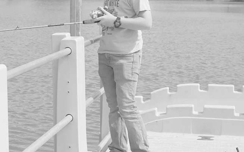 PATIENCE- Kade Gregory was waiting for a fish to slip up and take the bait he set out at Lobo Lake July 6, 2023. (Staff Photo by Aalijah Soliz)