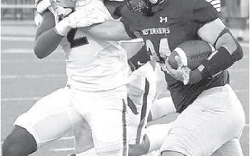 STRONG TACKLE- Levelland Lobo linebacker Ladarian Jordan fought off a stiff arm and pulled down a Lubbock High ball carrier during a road loss last Thursday. The Lobos will welcome the Estacado Matadors in to town for homecoming next Friday. (Photo Courtesy of Dom Puente)
