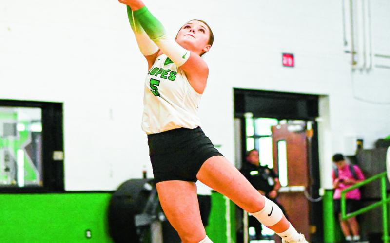 ACROBATIC PASS - Ropes’ Braedyn Reyna twists to play the volleyball and pass it to her teammates during a home game in August. (Staff photo by Jentezen Smith)
