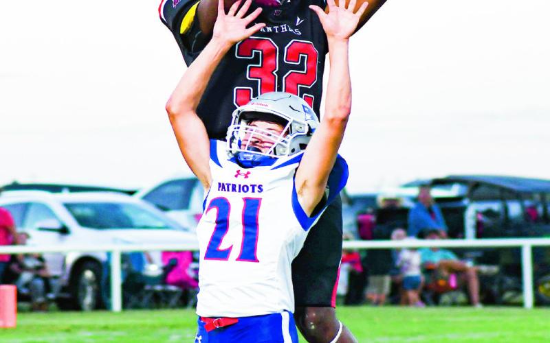 MOSSIN’ ‘EM - Whitharral’s Nate Sansom mosses a Valley defender during a home football game in September. (Staff photo by Jentezen Smith)