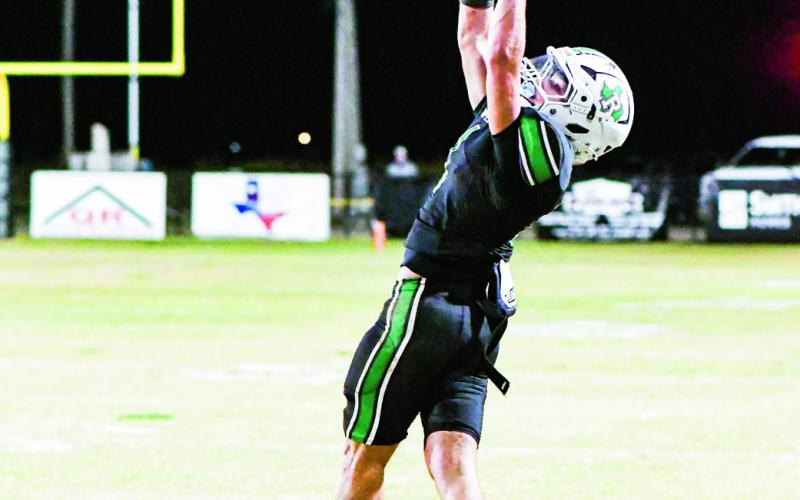 GET UP FOR IT - Ropes wide receiver Kolter Dockery jumps and extends to make a catch during a football game against Sundown in October. (Staff photo by Jentezen Smith)
