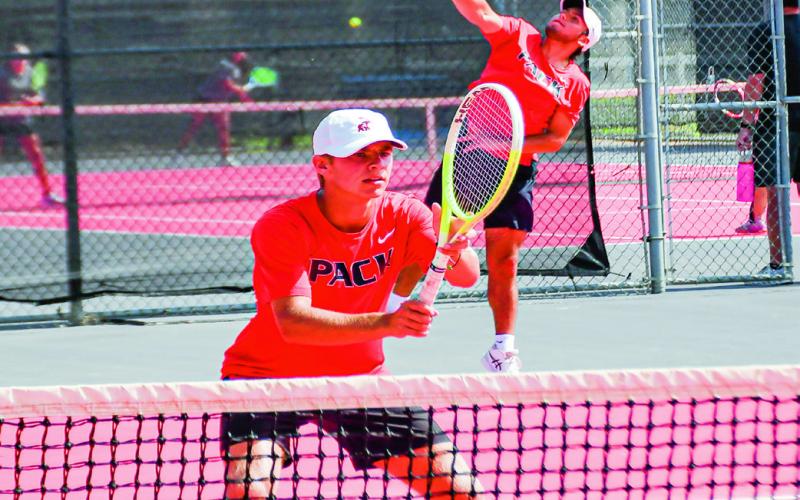 READY FOR SERVICE - Nathan Ellis gets in position for the set while William Canon serves it in a double’s matchup against Big Spring at the Levelland Tennis Courts in August. (Staff photo by Jentezen Smith)