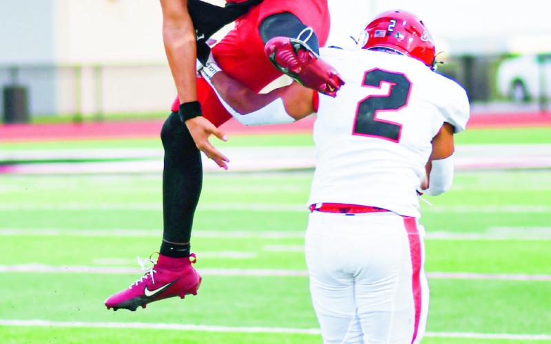 SALAZAR HURDLE - Levelland quarterback Ethan Sala- zar hurdles a Brownfield defender during a home football game in September. (Staff photo by Jentezen Smith)