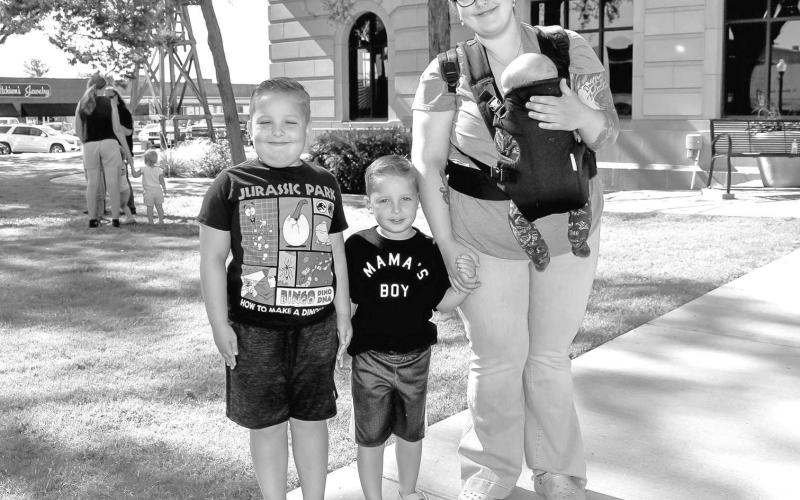 FAMILY FUN- The Hockley County City Library Summer Program continues to have summer activities for children participating in the program. On Wednesday, the program had a Treasure Chest Hunt on the lawn of the Levelland Court House where the children had to go to a different tree to pick up a clue that let them know where the treasure was located. Pictured is Sarah O’Hearon with her children Declan, Driscoll and Wyatt. (Staff photo by Emily Campos)
