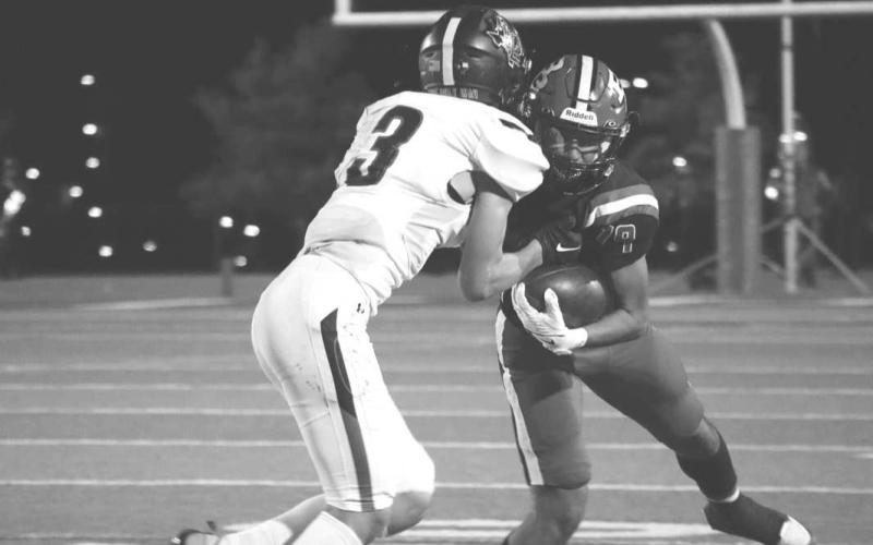 ONE ON ONE - Levelland athlete Gage Potter made the tackle on the Borger Bulldog to stop him in his tracks. The Lobos will play against Seminole this Friday at home at 7 p.m. (Staff photo by Aalijah Soliz)