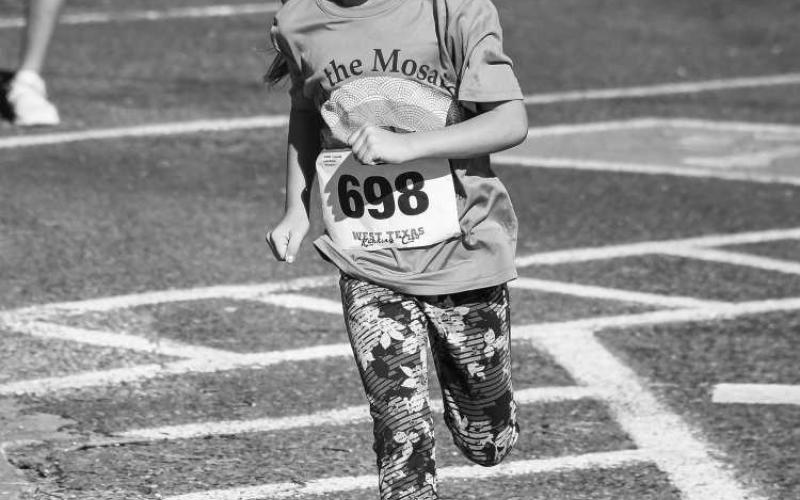 TINY TOT - Runners of all ages were encouraged to participate in the Run the Mosaics Bobby Birdsong Memorial Run last Saturday. Runners had to option to take part in the 10K, two mile and one mile