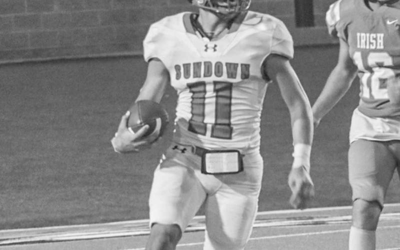 OPEN FIELD - Sundown Roughneck Marcus Solis got into the open field this past Thursday against the Shamrock Fighting Irish in Canyon for the team’s season opener. (Staff photo by Aalijah Soliz)