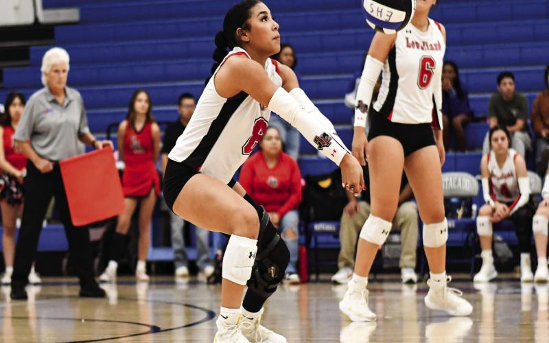ON THE PASS - Junior Mia Sepulbeda makes a play on the opponents serve and passes the volleyball to her Levelland Loboette teammates as senior Hailee Estrada watches during their match against Lubbock Estacado this past Tuesday at Estacado High School. (Staff photo by Jentezen Smith)