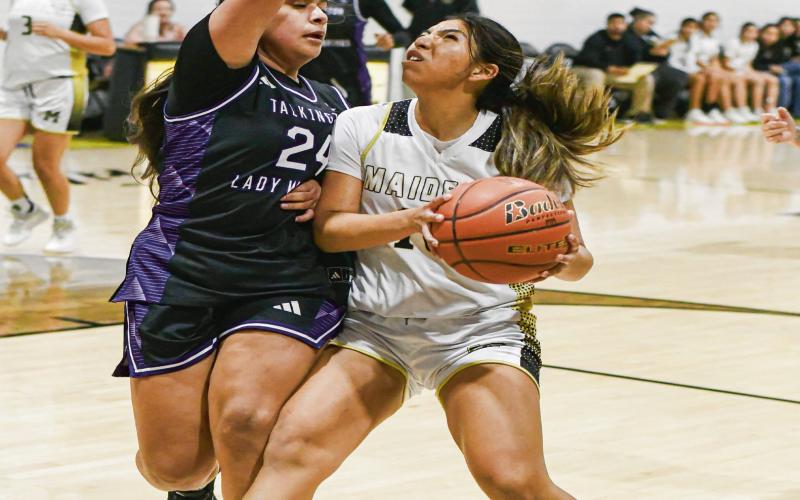 FINISH THROUGH THE CONTACT - Morton's Khloe Aguirre fights through the con tact to try and score during their basketball game against Talkington this past Tuesday night at Morton High School. Aguirre would have 13 points, six rebounds and three steals in the Maidens win. (Staff photo by Jentezen Smith)