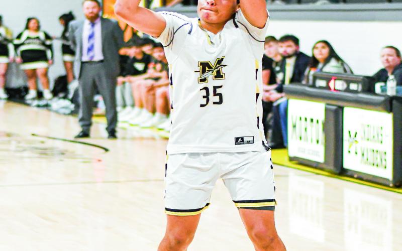 ACEVEDO FROM DEEP - Morton Indian Rafael Acevedo shoots a three-pointer during their district basketball game against Plains this past Tuesday at Morton High School. (Staff photo by Jentezen Smith)