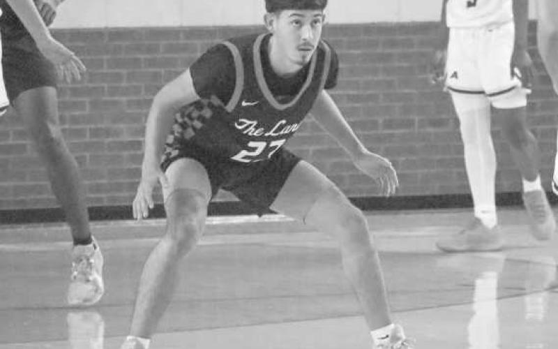 DEFENSE - Levelland Lobo Ozzie Salano pressured the Alpine Buck during the teams first game of the Denver City Tournament last weekend. The team took the win 49-43. (Staff photo by Aalijah Soliz)