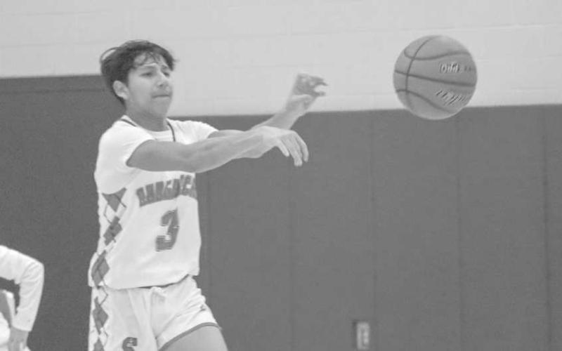 PASS - Sundown Roughneck Adan Escamilla passed the ball to his teammate in transition to give the offense a good look during the teams first game of their tournament. (Staff photo by Aalijah Soliz)
