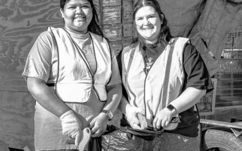 SPRING CLEANING - Pictured together are Jasmine Jasso (left) and Danika Conde (right) who volunteered their time to help clean up along Highway 114 this past Saturday during the Keep Levelland Beautiful Spring Cleanup. (Staff photo by Hannah Woodrum)